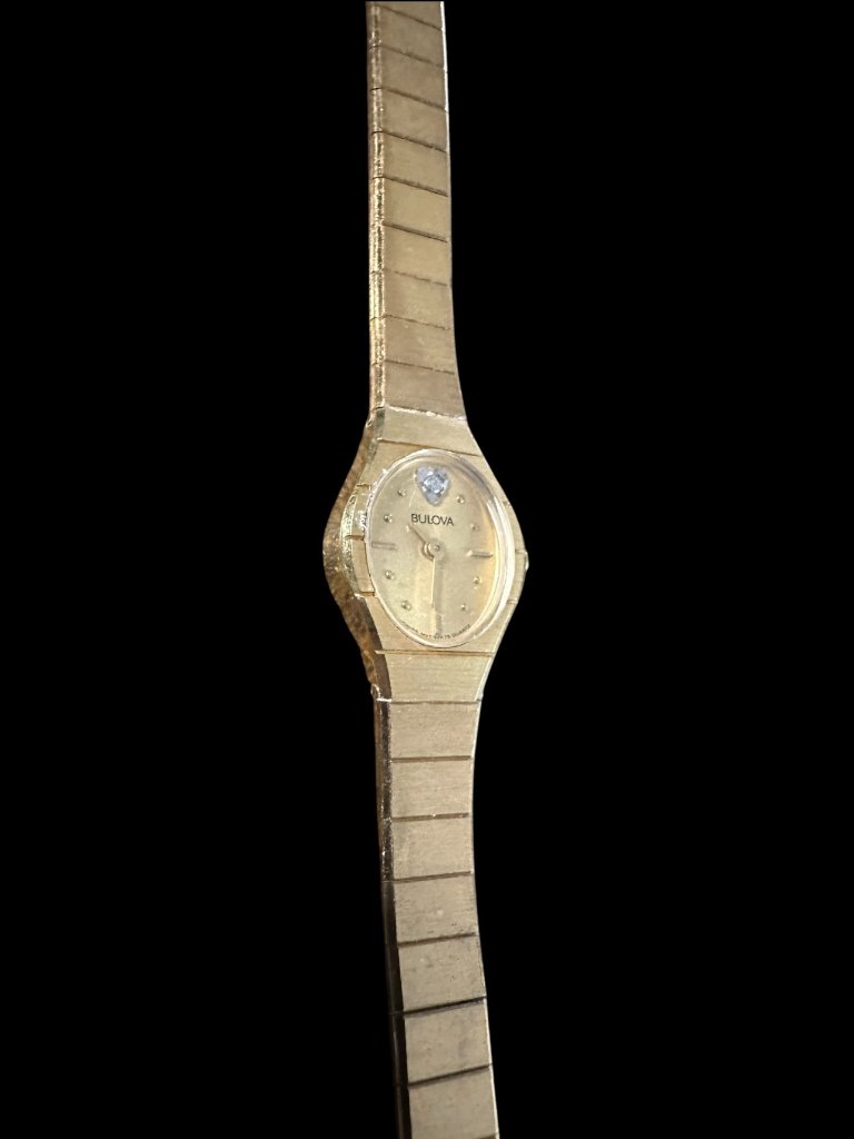 Bulova Quartz Womens Gold Tone Champagne Dial Diamond Watch